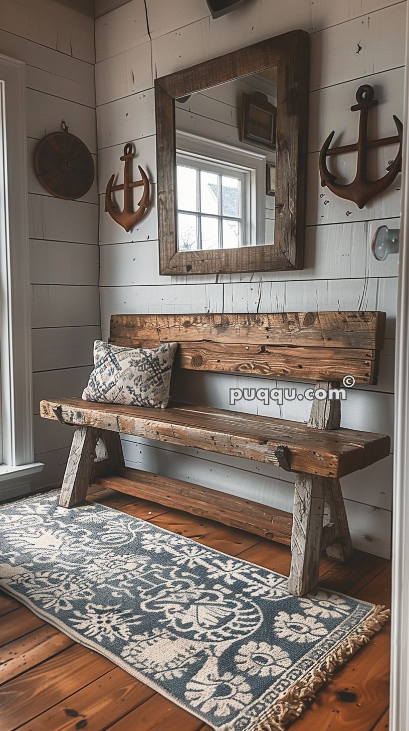 Rustic wooden bench with a patterned cushion in a cozy white-paneled room, decorated with nautical elements including a mirror and anchor wall ornaments, complemented by a blue and white patterned rug.