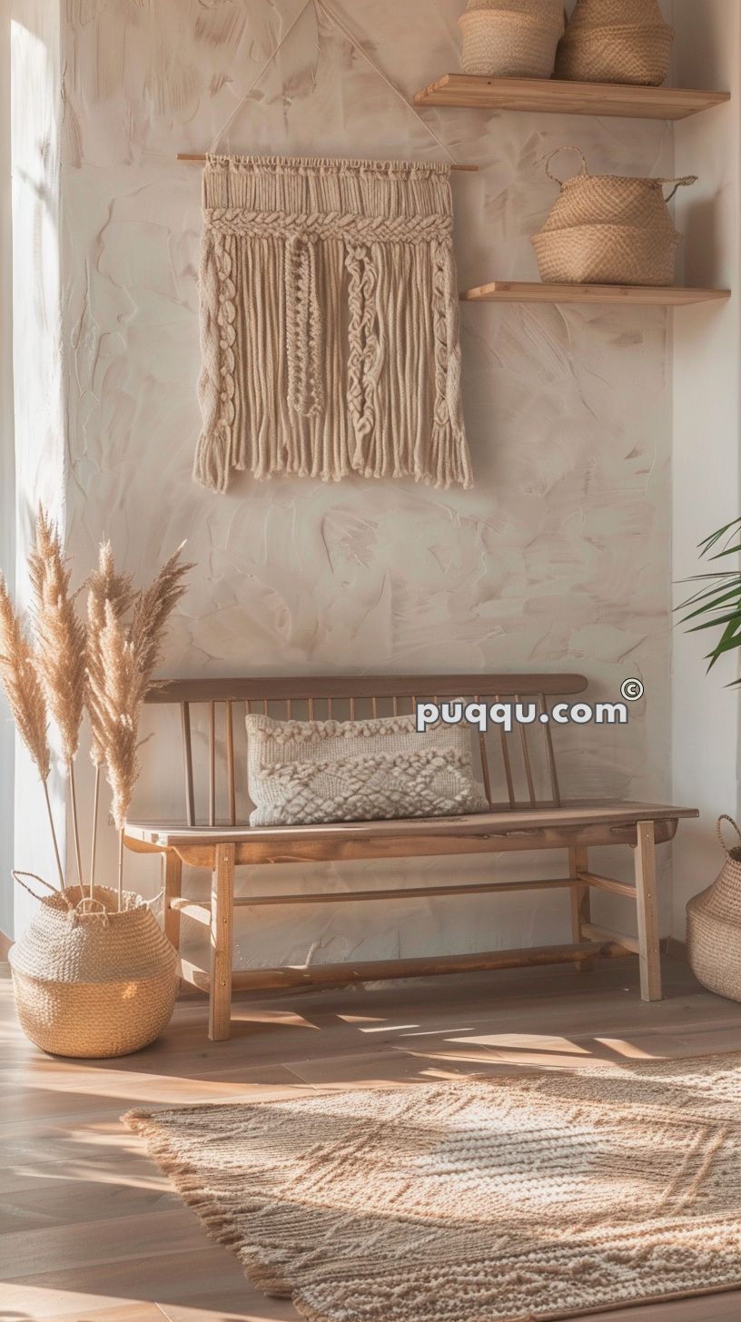 Cozy boho-themed room with a wooden bench, macrame wall hanging, decorative pillows, pampas grass, woven baskets, and a textured rug.