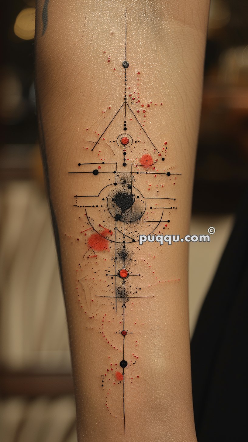 Geometric tattoo with black and red ink, featuring fine lines, dots, and abstract shapes on the inner forearm.