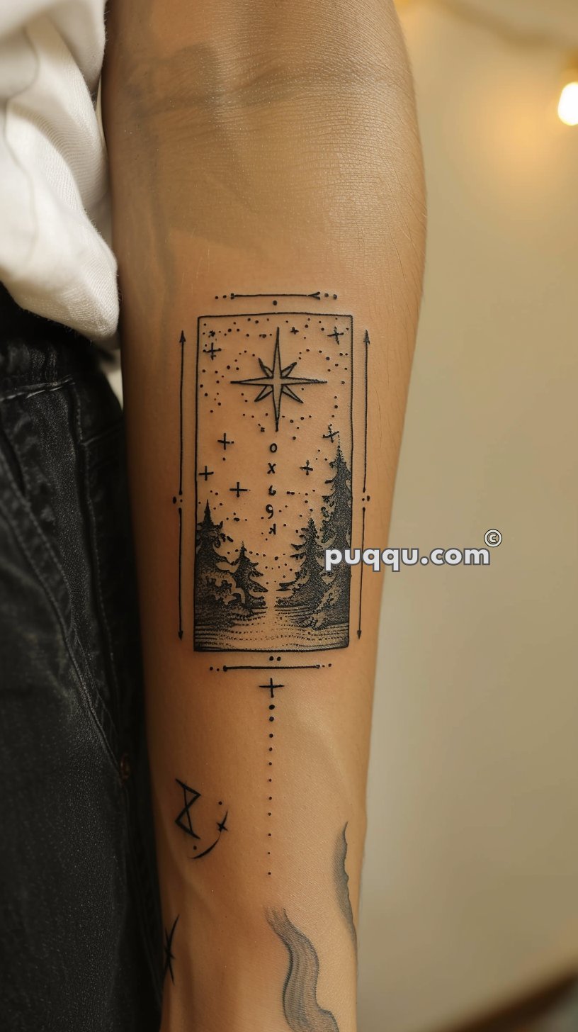 Tattoo on forearm featuring a rectangular frame with a starry night sky, a large star, coniferous trees, and additional geometric elements surrounding it.