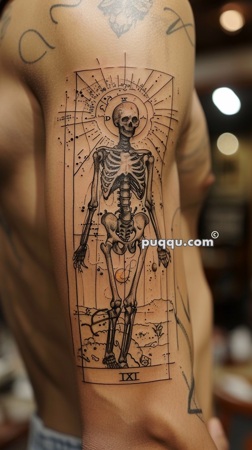 Tattoo of a skeletal figure in a detailed, geometric style with a sunburst design and various symbols around it on a person's upper arm.