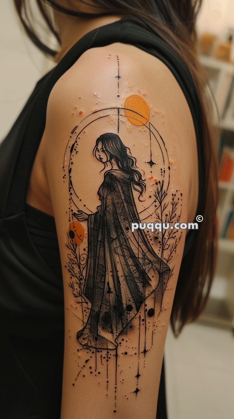 Tattoo of a cloaked woman with flowing hair surrounded by circular designs, stars, and a large orange sun on the upper arm.