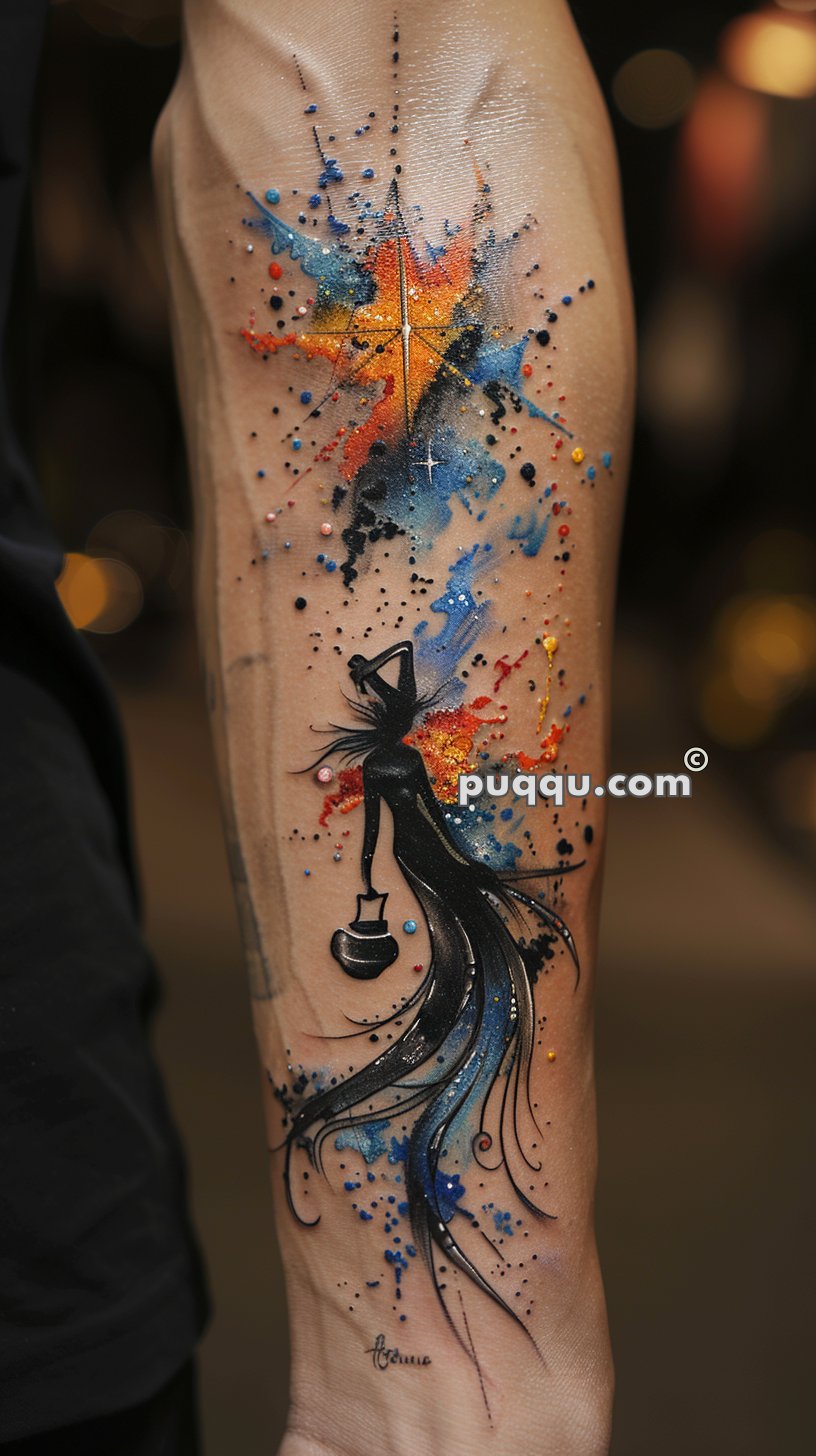 Colorful abstract tattoo on forearm depicting a silhouetted figure holding a lantern, with vibrant splashes of blue, yellow, and red paint.