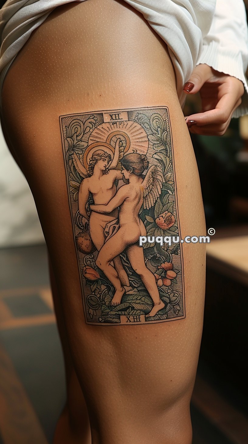 Detailed tattoo depicting two winged, nude figures surrounded by elaborate floral designs, located on the upper thigh of a person pulling up their shorts.