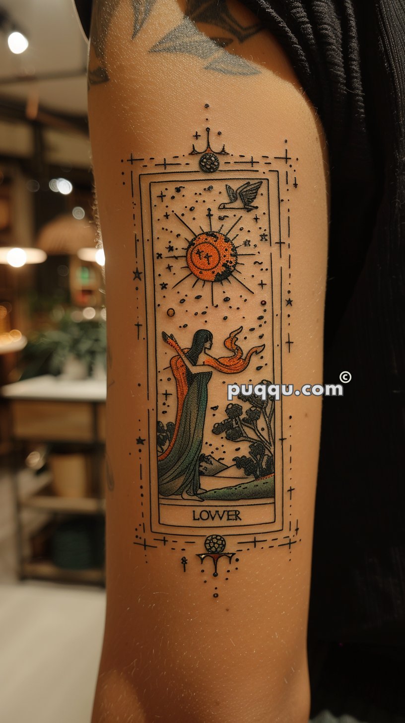 A tattoo of a tarot card on an arm, featuring an art nouveau style woman in a flowing dress, holding a bird, with a radiant sun overhead. The card is labeled "LOWER" and surrounded by intricate geometric patterns and star-like dots.