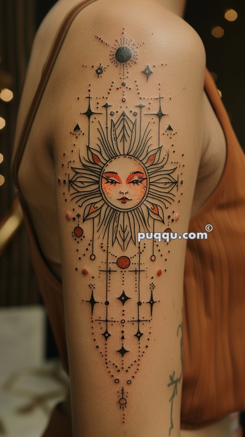 Tattoo of a stylized sun with a face, surrounded by intricate celestial designs, including stars, dots, and geometric shapes on an arm.