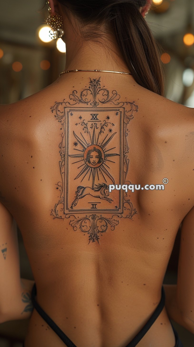 A detailed tattoo of a tarot card featuring a sun with a human face, surrounded by rays and small stars, with the Roman numeral XX above and a prancing horse below on a woman's upper back.