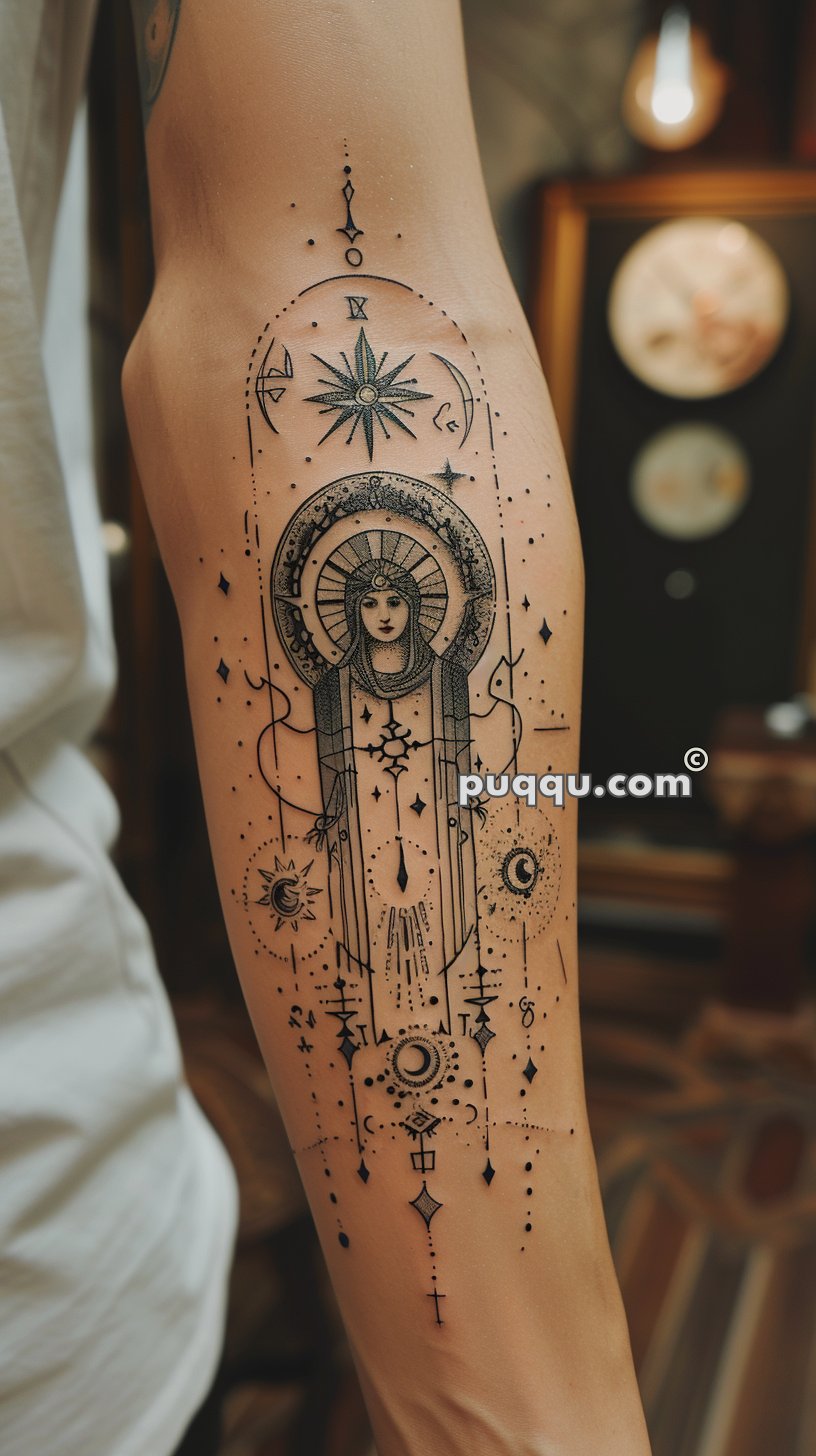 Ornate arm tattoo depicting a celestial figure with a radiant halo, surrounded by various astronomical symbols including stars, moons, and planets, all interconnected with intricate lines and geometric shapes.