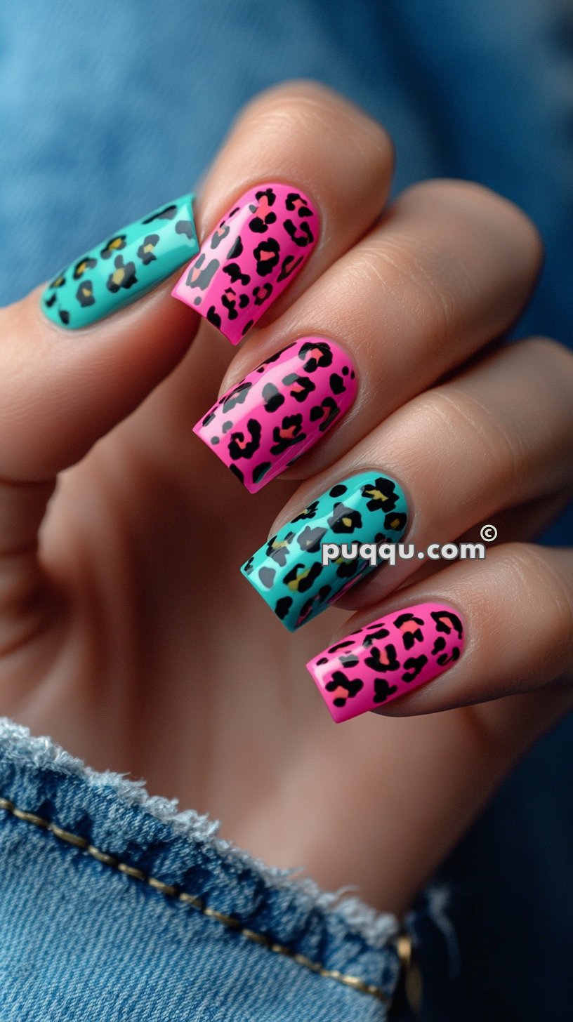 Pink and blue nails with black leopard print design.