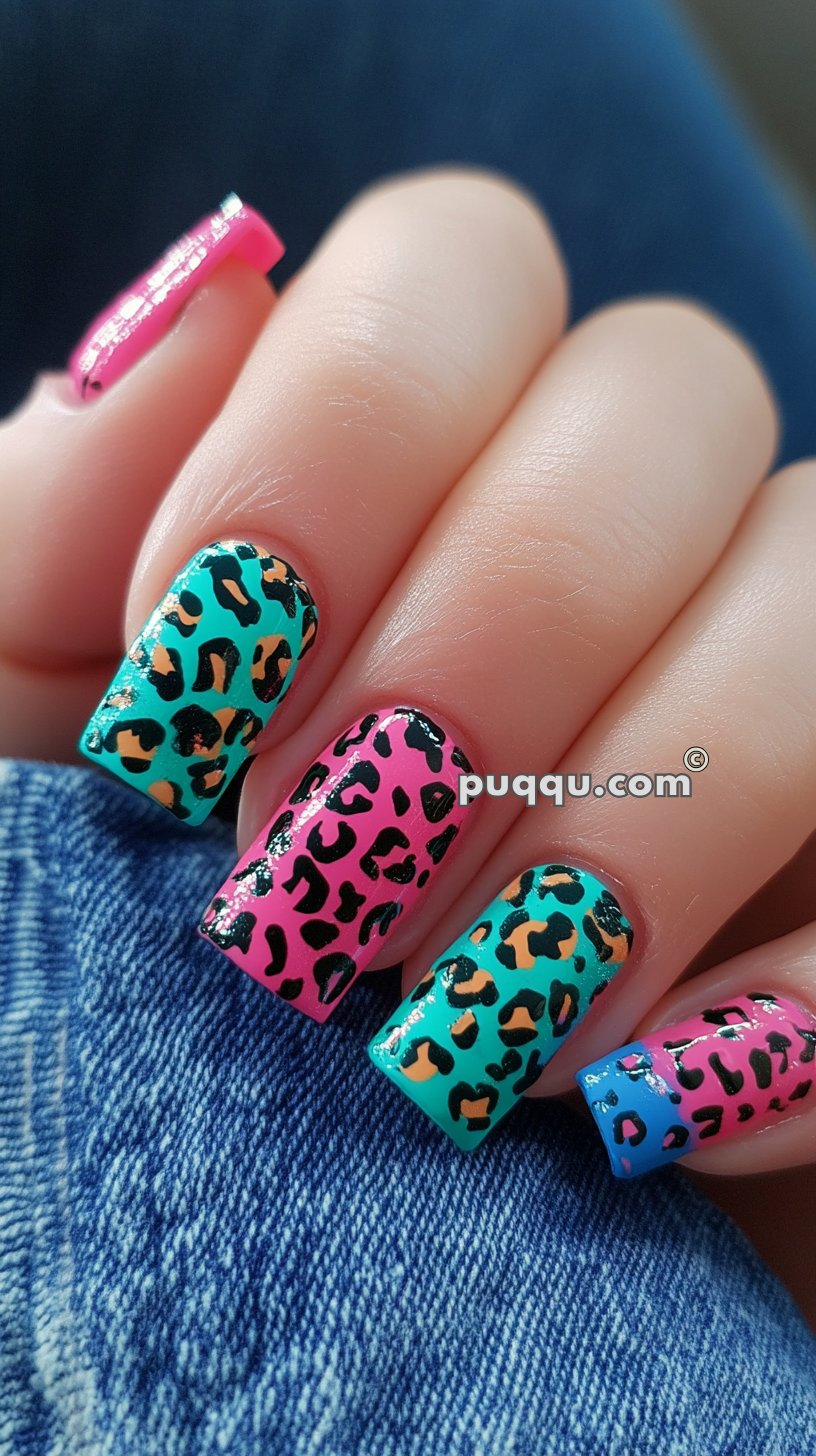 Multicolored leopard print nail art on medium-long square shaped nails.