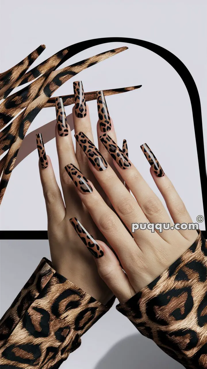 Hands with long square-shaped nails featuring a leopard print pattern, matching leopard print sleeves.