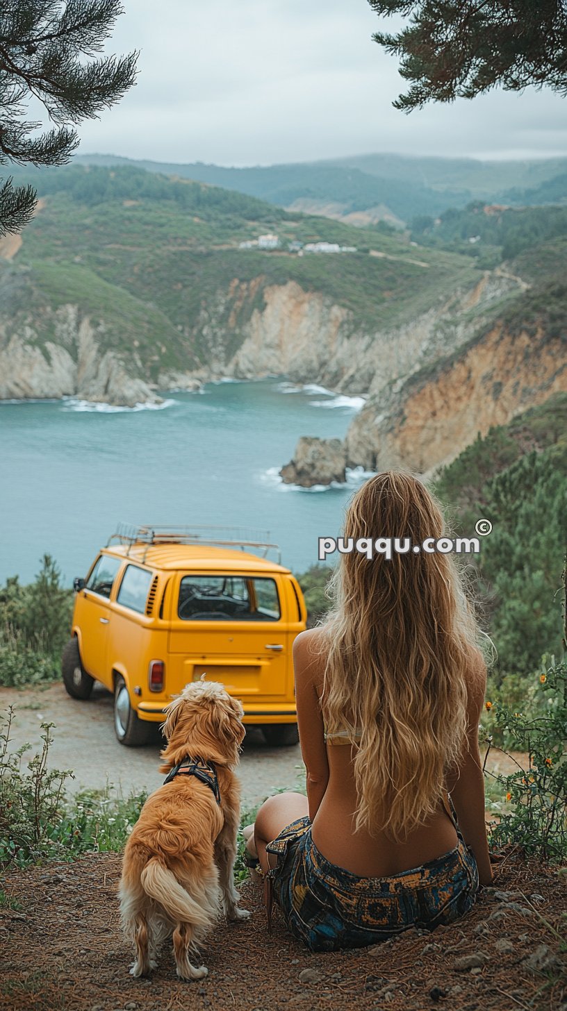 Woman with long hair and a dog sitting on a grassy hill overlooking a yellow van and ocean cliffs.