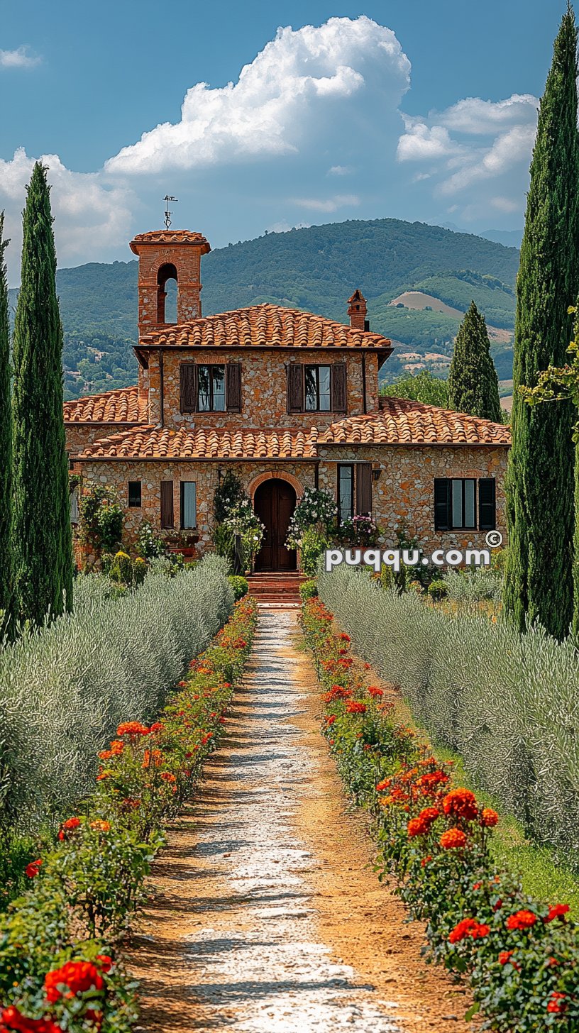 Stone house with terracotta roof, surrounded by cypress trees and flowering plants, with a gravel path leading to the entrance.