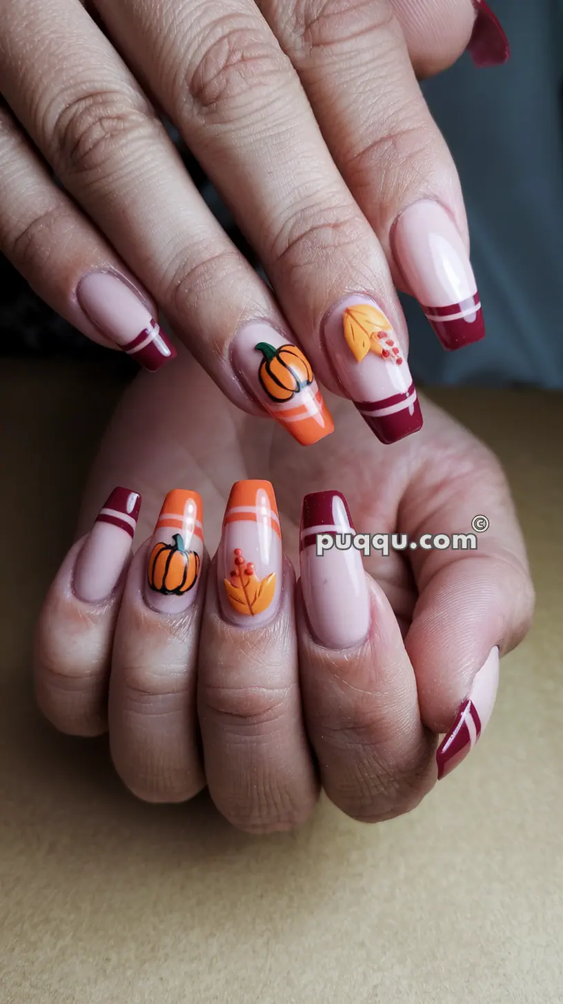 Nails with autumn-themed designs including pumpkins, leaves, and red and orange French tips.