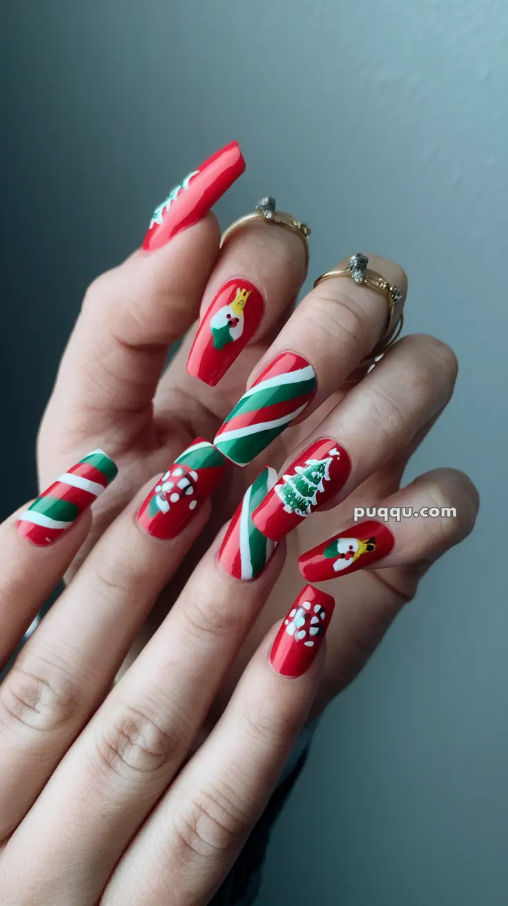 Festive red nails with Christmas-themed designs, including snowflakes, Santa Claus, a Christmas tree, and stripes.