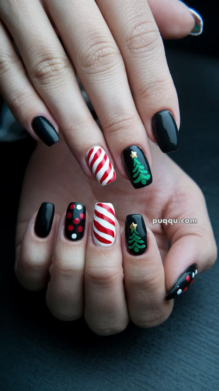 Close-up of hands with festive nail art, featuring black polish, red and white stripes, polka dots, and Christmas tree designs.