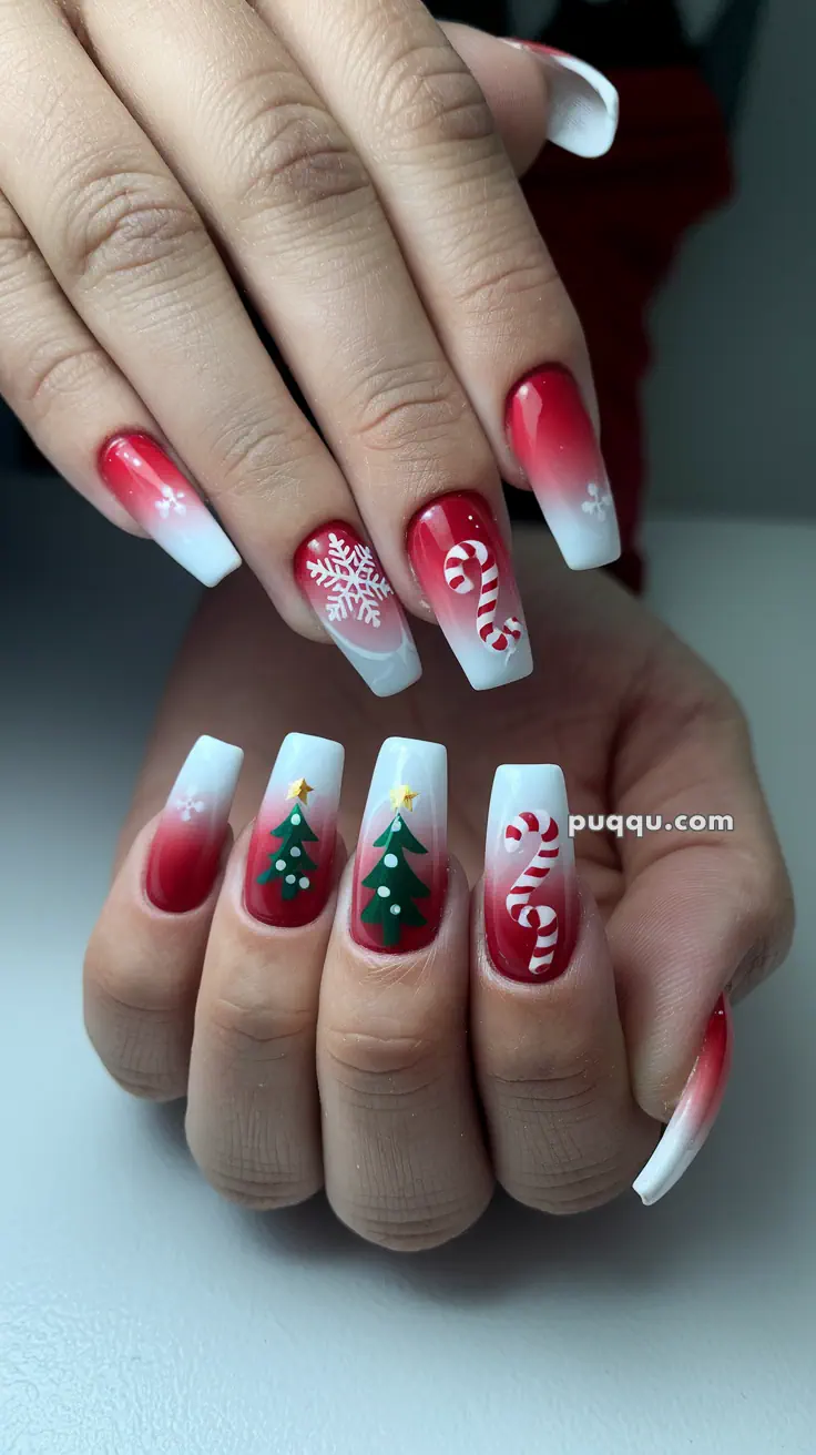 Christmas-themed nail art with red and white gradient, featuring snowflakes, candy canes, and Christmas trees.