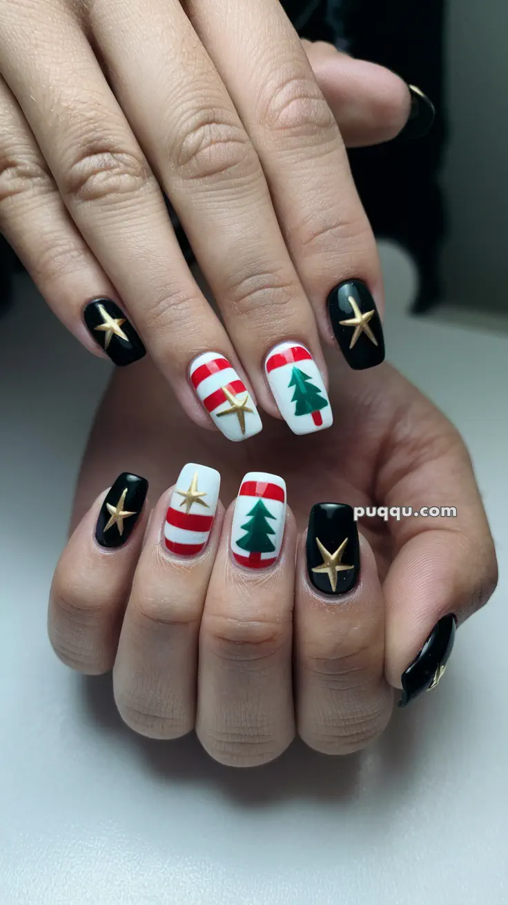 Christmas-themed nail art with black nails featuring gold stars and white nails with red stripes and green Christmas trees.