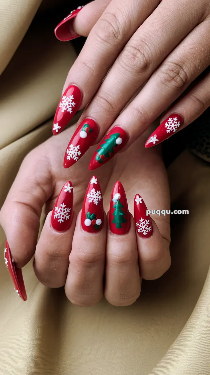 Red nails with Christmas-themed designs including white snowflakes and green Christmas trees.