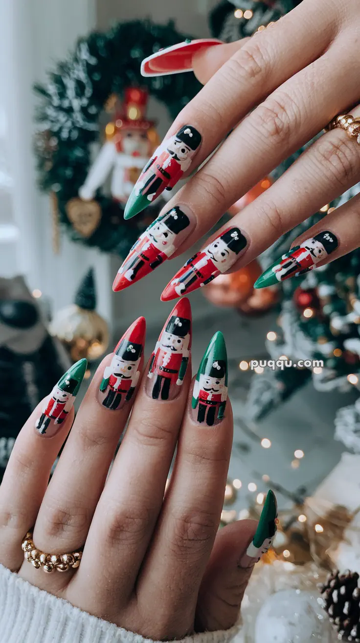 Manicured nails with nutcracker-themed nail art in red, green, and black, set against a festive background.