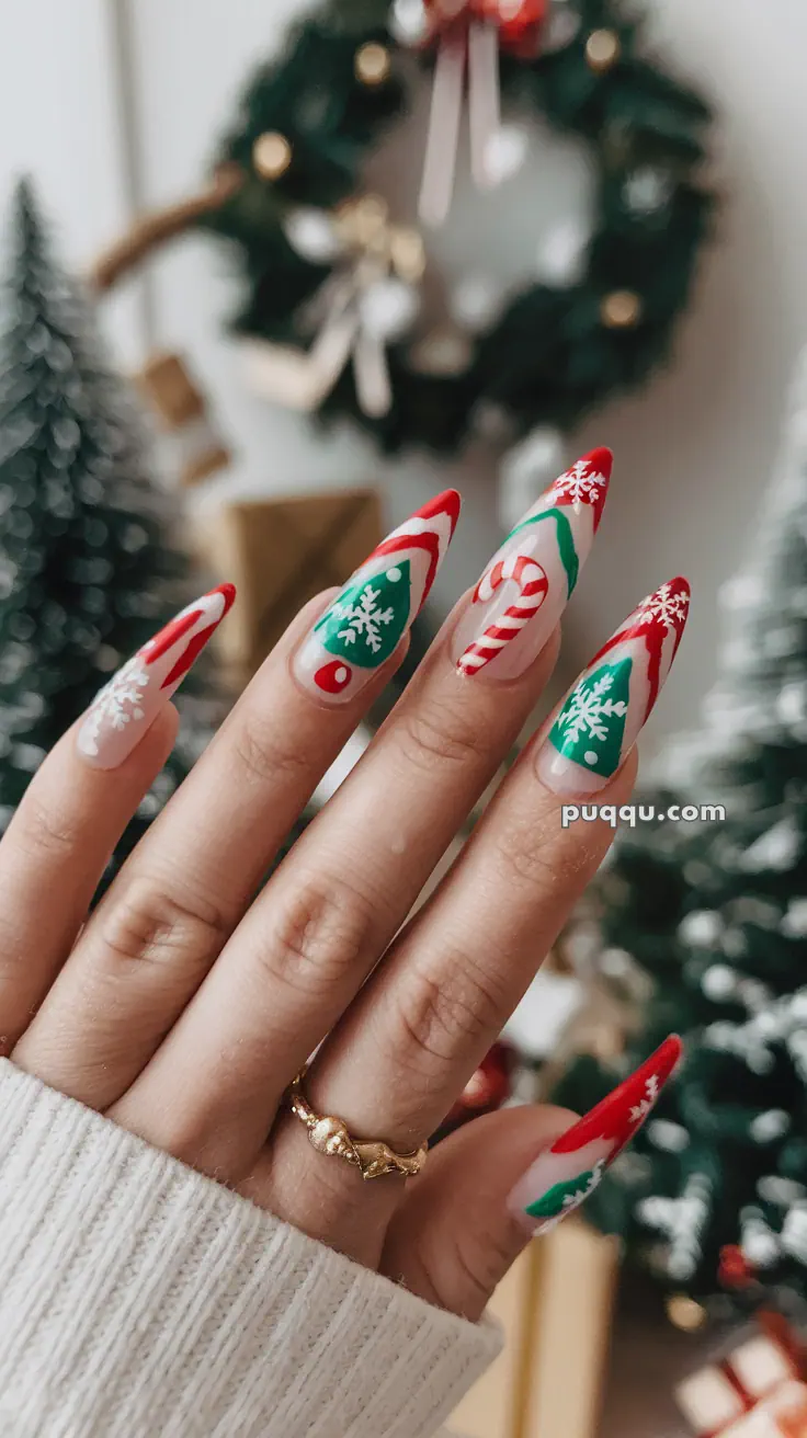 Hand with festive Christmas-themed nail art, including candy canes, snowflakes, and Christmas trees.