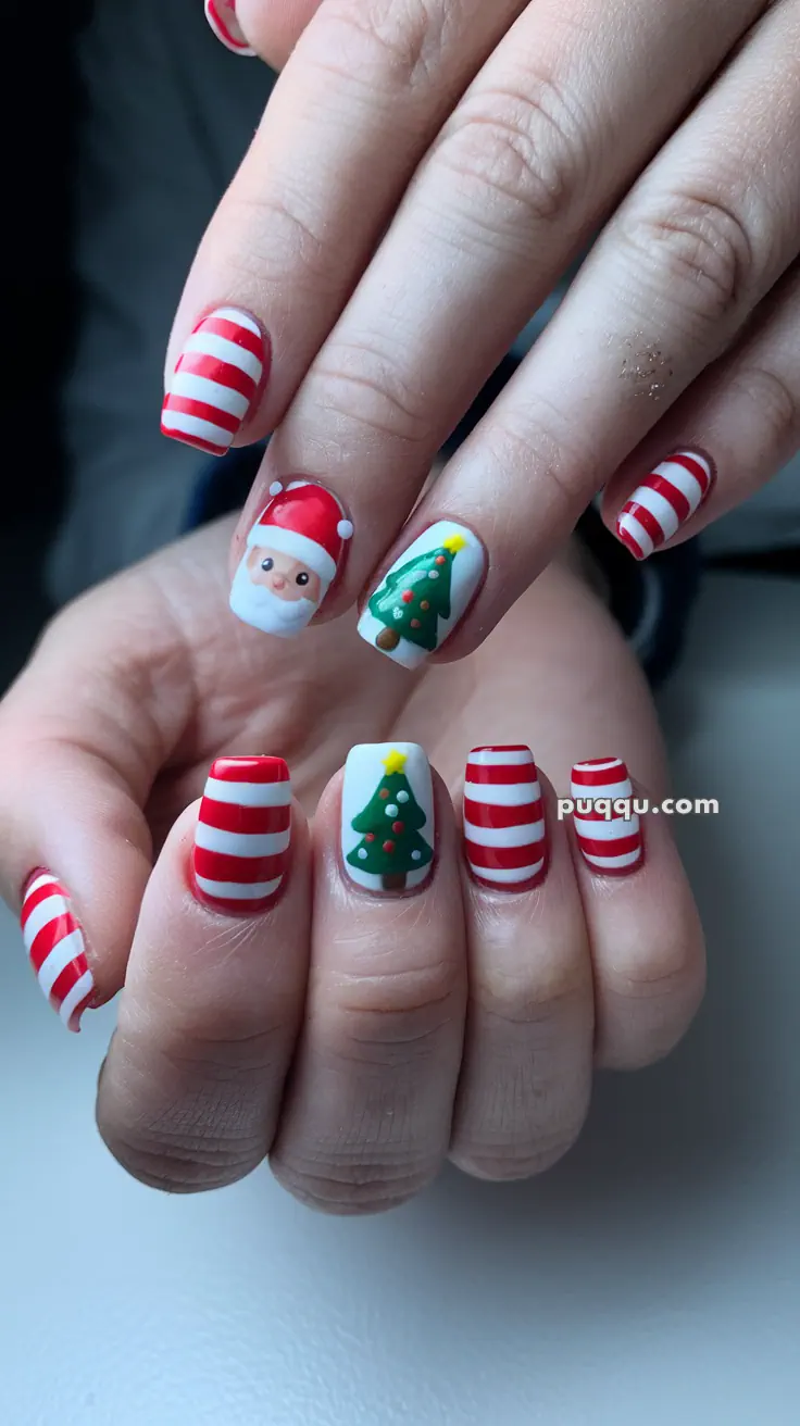 Close-up of hands with festive nail art, featuring red and white stripes, a Santa face, and Christmas tree designs.