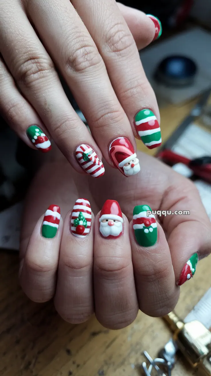 Christmas-themed nail art with Santa Claus, candy cane stripes, and festive colors.