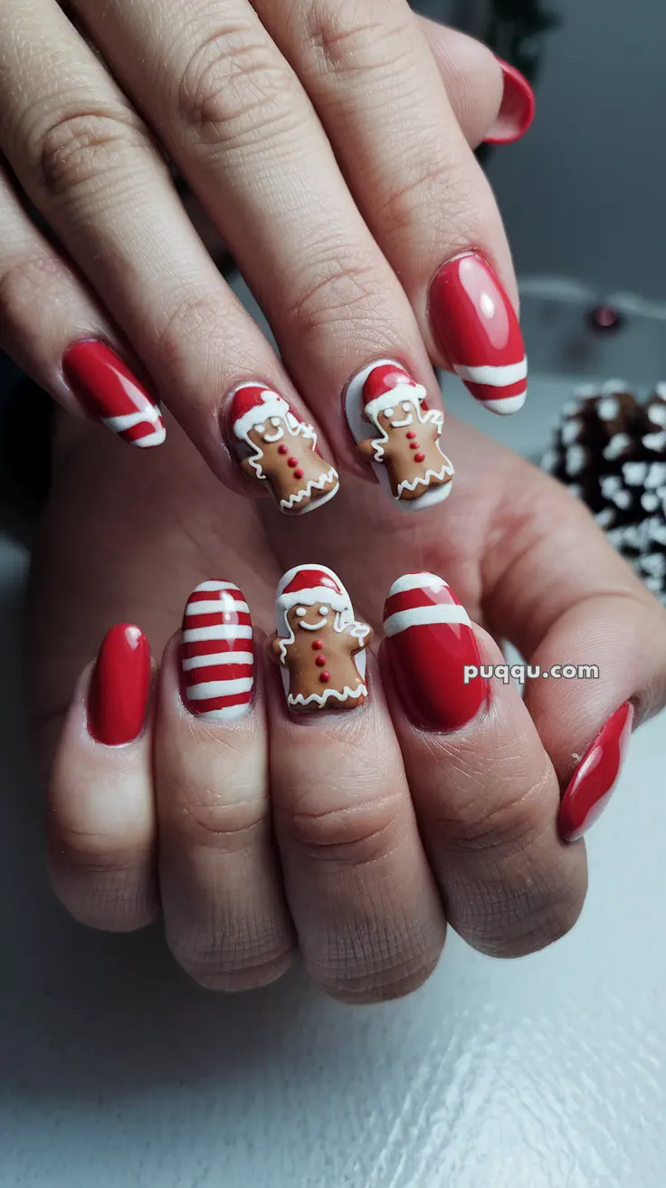 Festive red and white Christmas-themed nail art with gingerbread designs.