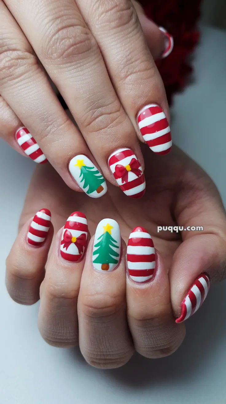 Fingernails with Christmas-themed nail art featuring red and white stripes, Christmas trees, and bows.