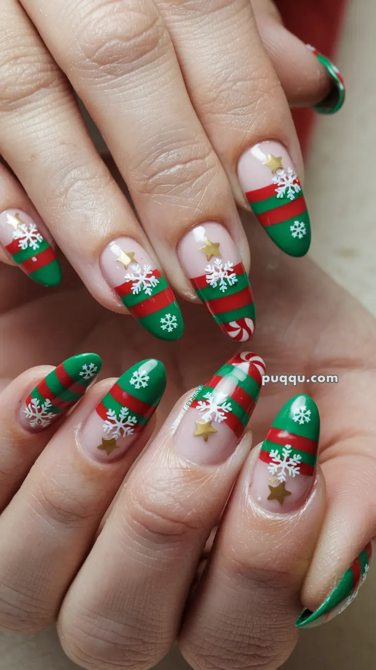 Nails with Christmas-themed designs featuring green and red stripes, white snowflakes, gold stars, and candy cane patterns.