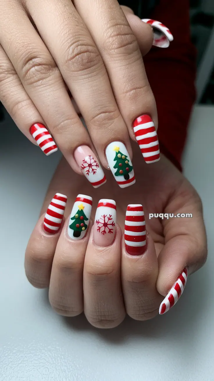 Festive nail art with red and white stripes, Christmas tree designs, and snowflake patterns.