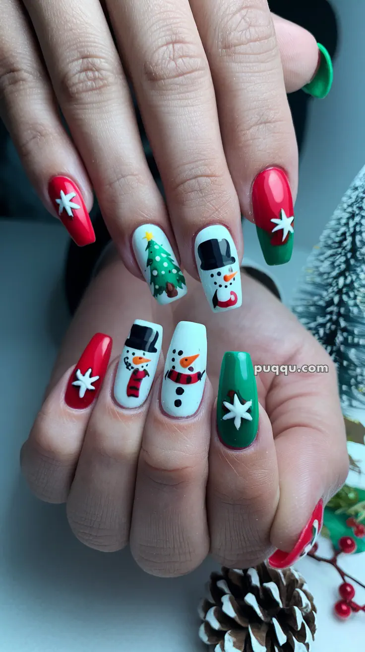 Festive nail art featuring snowmen, Christmas trees, and white stars on red and green backgrounds.