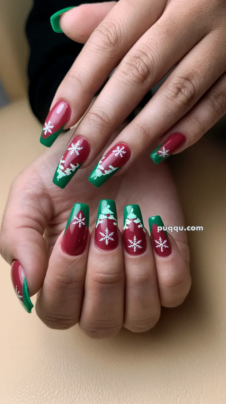 Red and green Christmas-themed nail art with white snowflakes and decorative tips.