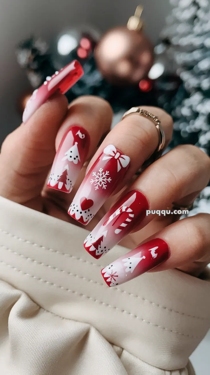 Close-up of festive red and white Christmas-themed nail art with snowflakes, bows, candy canes, and trees.