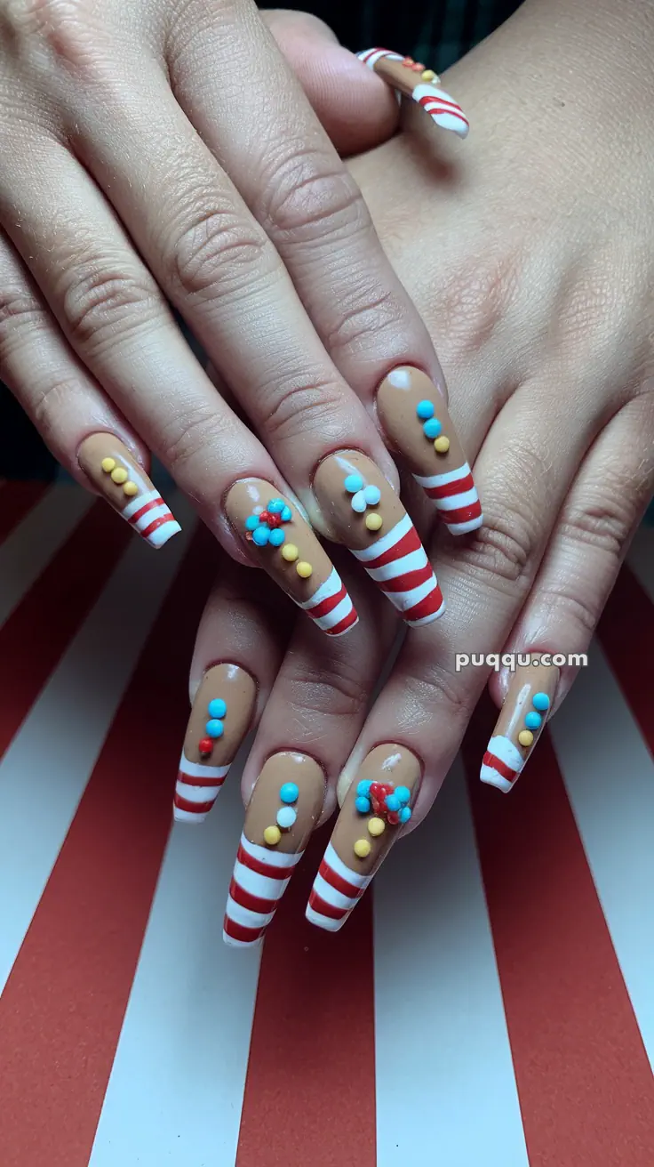 Nails with candy cane stripes and colorful polka dot decorations.