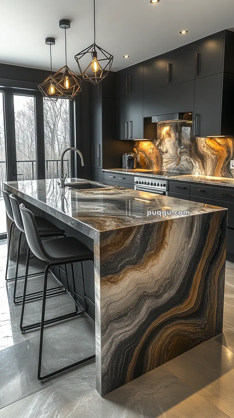 Modern kitchen with black cabinets, a large marble island featuring dramatic veining, high-backed stools, and geometric pendant lights.