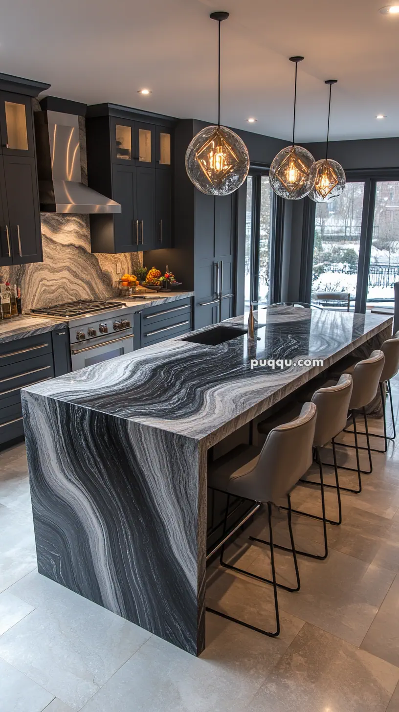 Modern kitchen with black marble island, bar stools, dark cabinets, and pendant lighting.