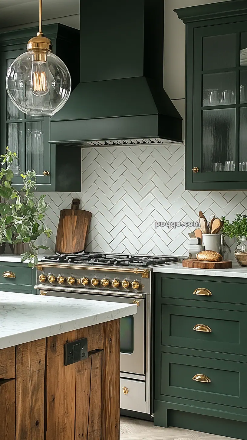 Kitchen with dark green cabinets, brass hardware, a gas stove, white herringbone tile backsplash, and a wooden island with a marble countertop.