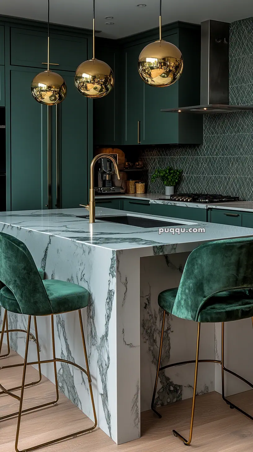 Modern kitchen with green cabinets, marble island, gold pendant lights, and green velvet bar stools.