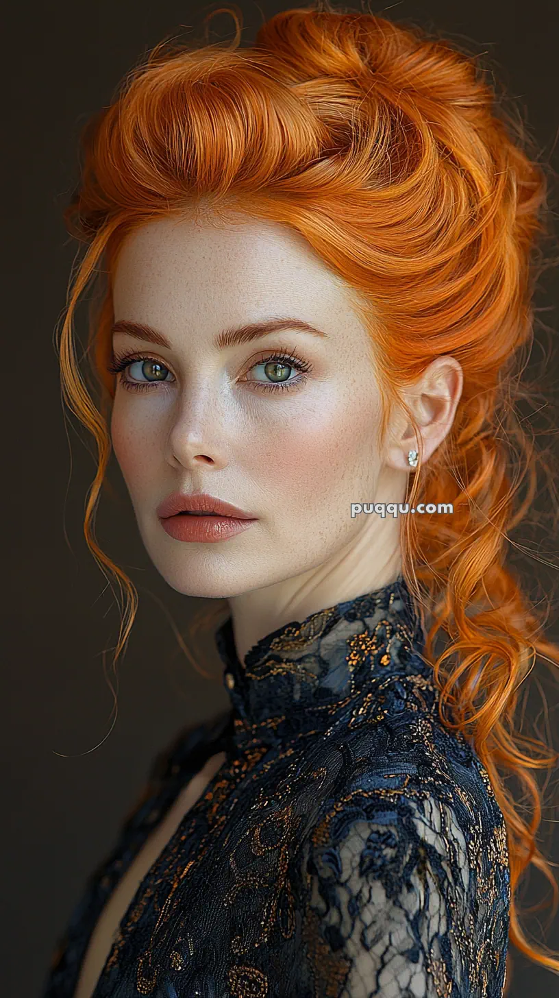 A woman with vibrant red hair in an elegant updo, wearing a high-collared lace dress, looking at the camera.