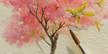 A watercolor painting of a cherry blossom tree with pink blooms, set against a light background, with a fine artist's paintbrush resting on the paper.