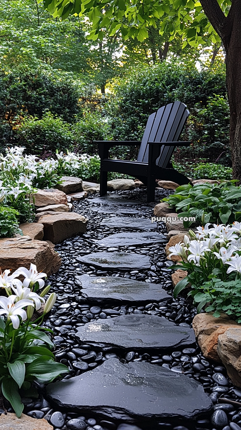 A serene garden path with black stone steps surrounded by white flowers, leading to a black wooden chair under a tree and among lush greenery.
