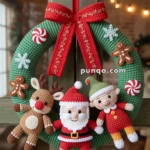 A crochet Christmas wreath featuring Santa Claus, a reindeer, and an elf, adorned with red and white candy patterns and gingerbread men, hung by a red ribbon with gold stitching.