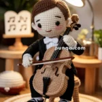 A crocheted doll in formal attire playing a cello, seated under a lamp, with a music stand and potted plants in the background.