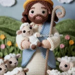 Crocheted figure dressed as a shepherd holding a small sheep, surrounded by more sheep, with a crochet sun and clouds in the background.