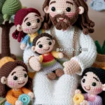 Crocheted figures of a man with children, surrounded by colorful clouds, a rainbow, and a tree in the background.