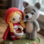Amigurumi figures of Little Red Riding Hood with a red hood and a basket and a gray wolf stand on a circular green crochet mat with flower details.