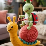 A colorful crocheted toy showing a happy green ladybug riding a large, smiling yellow snail with a red shell, displayed on a wooden table in a cozy room setting.