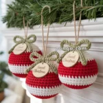 Three crocheted red and white Christmas ornaments with green bows and "Sweet Christmas" wooden tags hang below a garland of greenery.