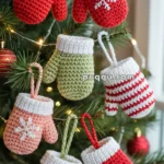 Crocheted mitten ornaments in various colors and patterns hang on a Christmas tree.